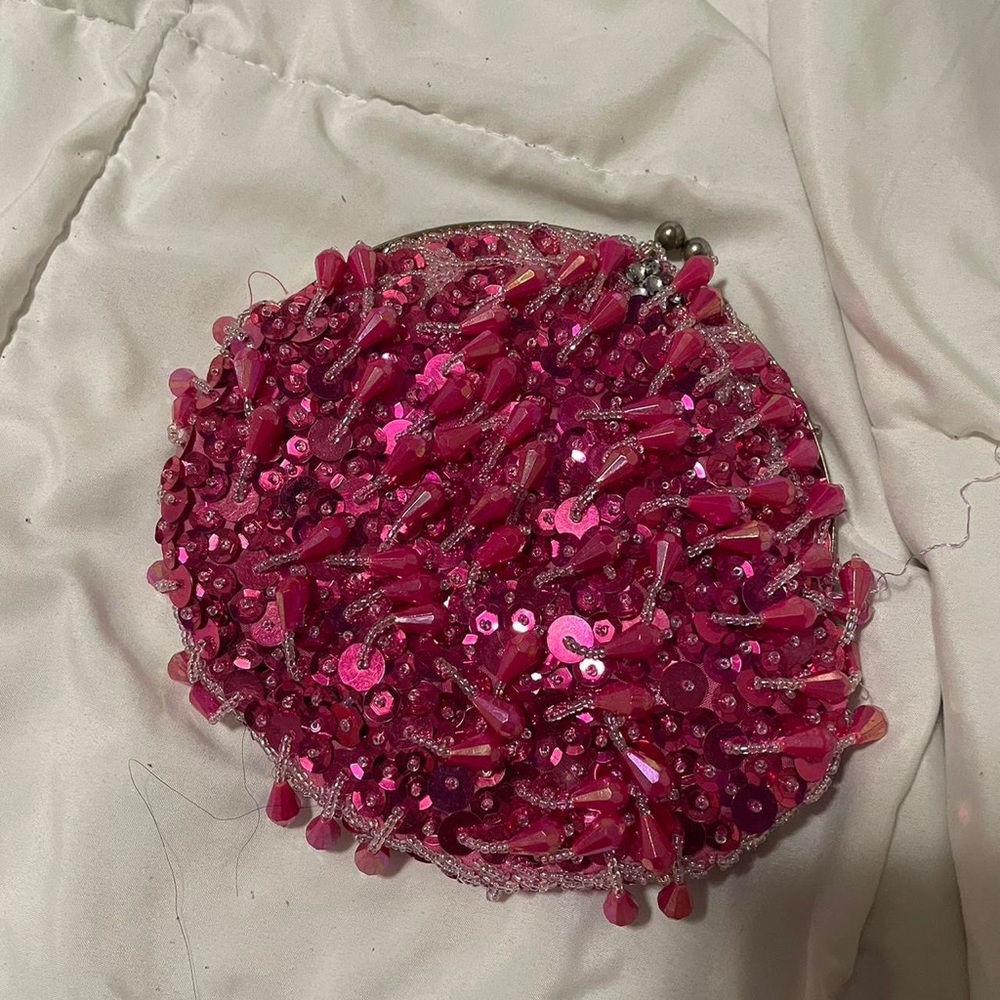 Cute Fuchsia colored beaded clutch.